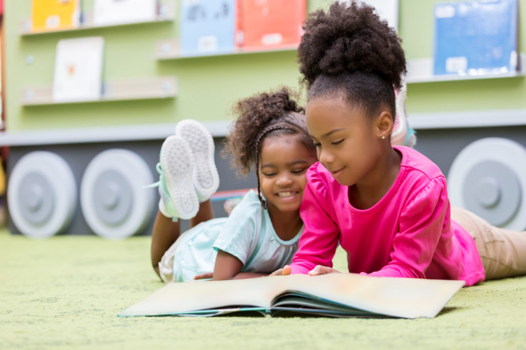 two girls reading