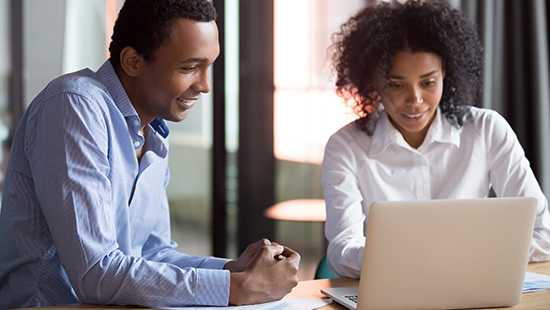 Mentorship feature image, Mixed-race mentor manager consulting african client teaching employee with laptop